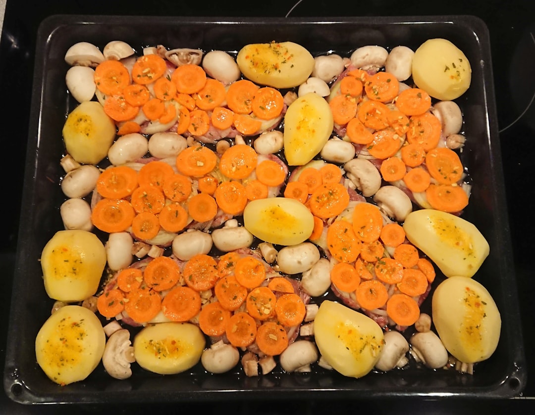 Golden baked sweet potatoes stuffed with colorful microgreens and toppings on rustic wooden table