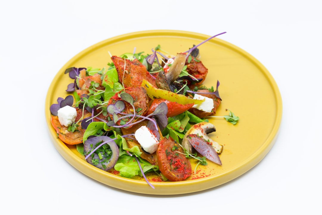 Fresh lobster roll with microgreens on brioche bun with lemon wedge