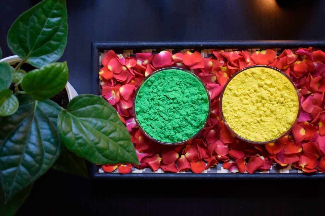 Colorful buddha bowl with roasted vegetables and fresh microgreens on rustic wooden table