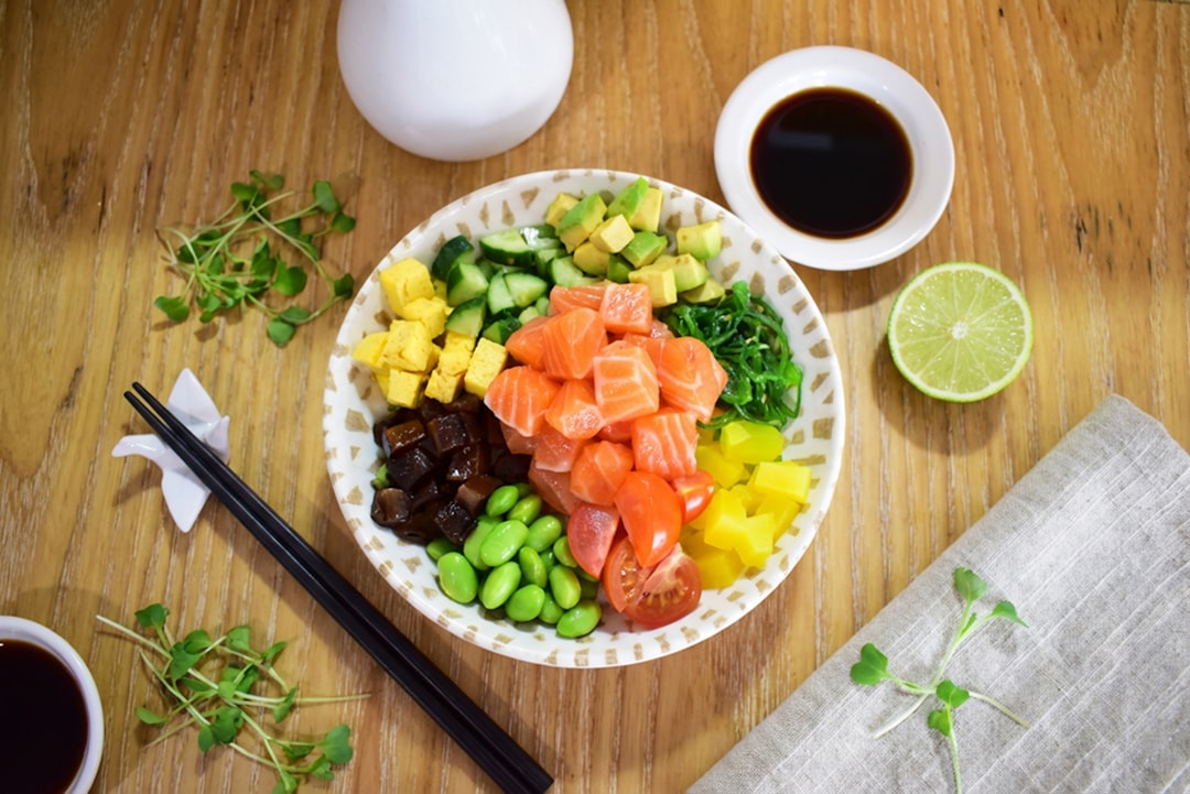 Colorful microgreen sushi rolls with avocado on bamboo mat