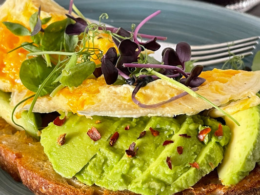 Avocado toast with egg and microgreens